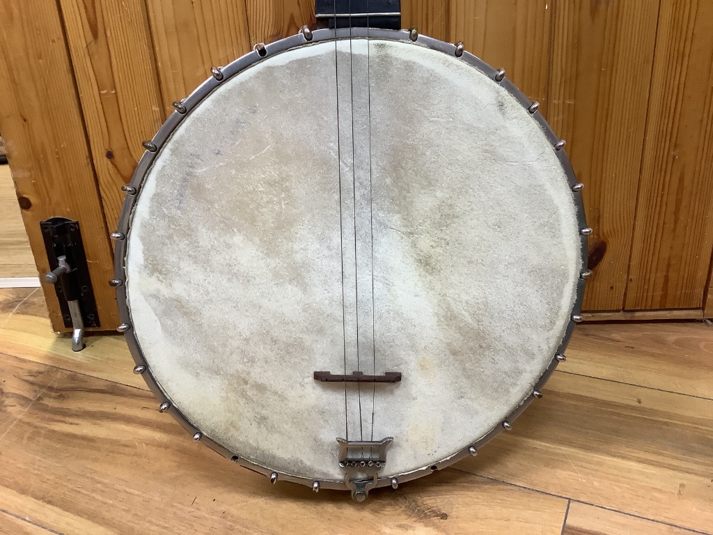 A cased banjo, unmarked